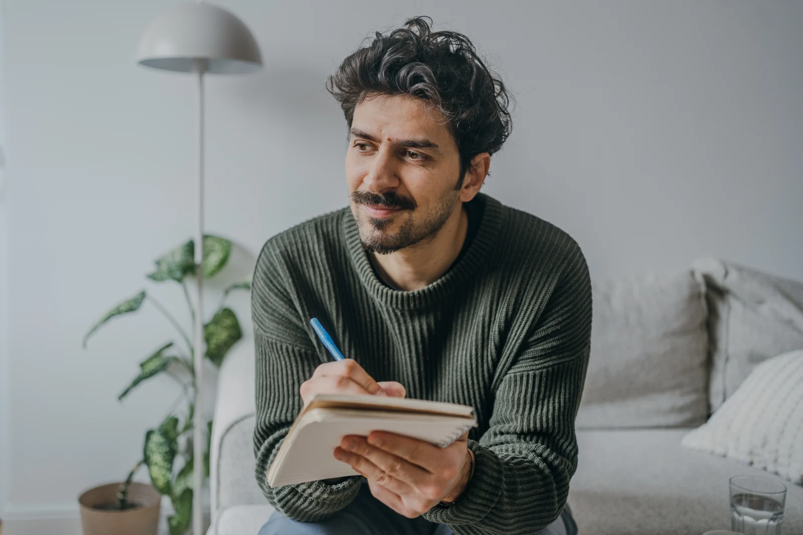 Man writing in a journal – online psychiatry in Santa Fe, NM